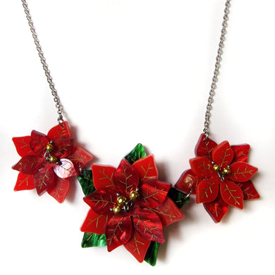collana in plexiglass stella di natale piegata a mano taglio laser in rosso e vedre e rosso madreperla, dettagli dipinti a mano in oro e perline dorate