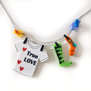 Mismatched socks in love necklace, drying in the sun
